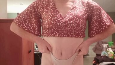 Tranny LisaB. takes her clothes off slowly.