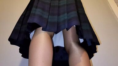 Pleated skirt with white slip. - 1 image