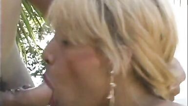 Pretty blonde shemale bet banged by jockstrap near pool - 4 image