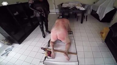 Two mature shemales whip and flogg a slave - 14 image