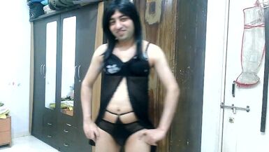 Sissy crossdresser femboy in black lingerie with sexy sheer designer pantie inside it. - 1 image