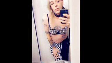 Trans Rocker Teasing Her Boobs - 1 image