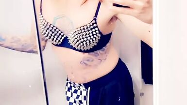 Trans Rocker Showing Off Her Boobs - 1 image