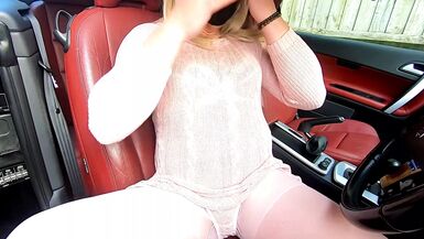 kelly cd in pink dress and pantyhose playing with her new toy in the car - 1 image