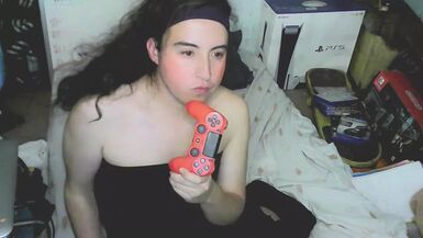 Cute cd girl, beautiful eyes and face. Kissing, licking and sucking a playstation controller. Sweet cd girl next door. - 1 image