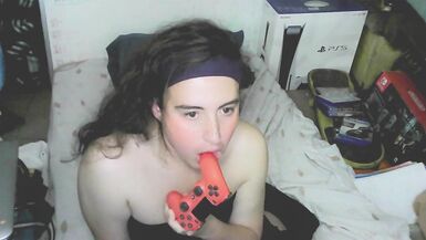 Cute cd girl, beautiful eyes and face. Kissing, licking and sucking a playstation controller. Sweet cd girl next door. - 2 image