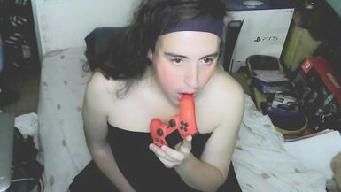 Cute cd girl, beautiful eyes and face. Kissing, licking and sucking a playstation controller. Sweet cd girl next door. - 7 image