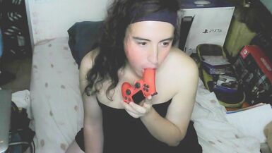 Cute cd girl, beautiful eyes and face. Kissing, licking and sucking a playstation controller. Sweet cd girl next door. - 9 image