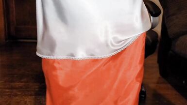 Long lined orange satin skirt with a white silky half slip. - 14 image