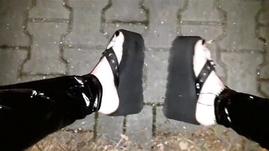 crossdresser on a public street in latex leggings and sexy platform flip flops - 11 image