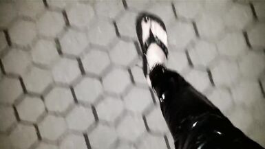 crossdresser on a public street in latex leggings and sexy platform flip flops - 9 image