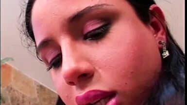 Black guy is on his knees sucking the shemale's cock and fucking her ass