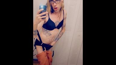 Cute girl in suspenders shows her underwear while masturbating