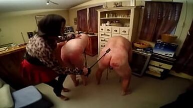Two men whipped by mature shemale - 1 image
