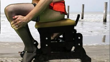 Mrs Samantha riding her Love Glider fuck-chair at the beach, until she comes hard! - 1 image