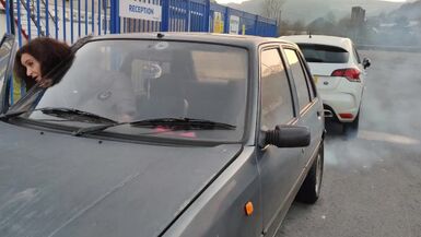 Tranny gilf starting and driving an ancient peugeot 205 diesel sfw NOT PORN - 1 image