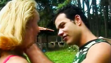 Pretty inexperienced shemale Claudia Hunter with small tits and fair hair in red lingerie was banged on the cutting in a forest - 2 image