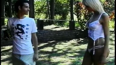 Stud sucks tranny cock then fucks her ass and cums on her belly on the lawn