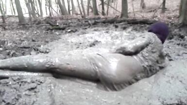 in a mini dress she is playing in the mud - 10 image