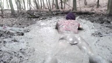 in a mini dress she is playing in the mud - 12 image