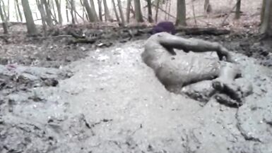 in a mini dress she is playing in the mud - 13 image