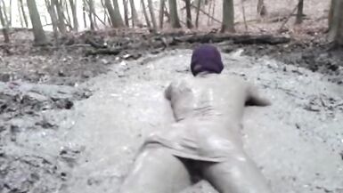 in a mini dress she is playing in the mud - 15 image