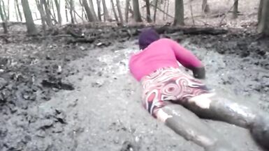 in a mini dress she is playing in the mud - 6 image