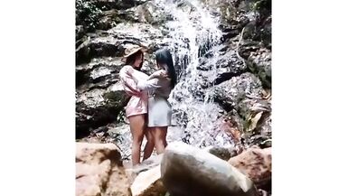 Two lesbian trannies by the cascade outdoors making love - 13 image