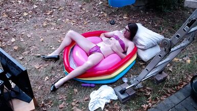 Outdoor WAM sissy gurl in pink pvc micro bikini oiled up and drenched in milky water plays with herself no cum - 1 image