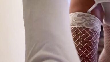 Crossdresser in short white dress posing, riding huge dildo, and stroking hard cock - 5 image