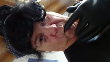 latex masked perv bessy enjoys sitting on giant dildoplug - 1 image