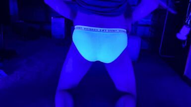 Sissy femboy shemale plays with her butt under blacklight - 3 image