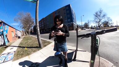 Short skirt on a scooter - 2 image