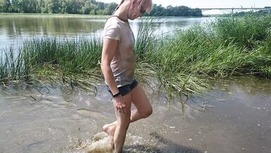Alexa Cosmic transgirl swimming in clothes in river in jeans shirts and white t-shirt. Alexa Cosmic Wetlook Lover. - 1 image