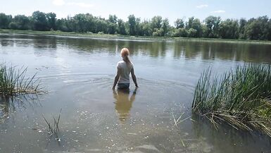 Alexa Cosmic transgirl swimming in clothes in river in jeans shirts and white t-shirt. Alexa Cosmic Wetlook Lover. - 4 image