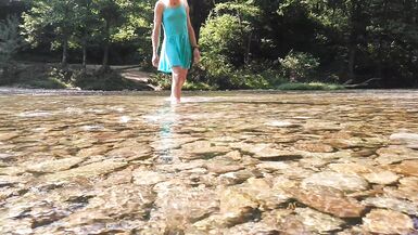Sexy t-girl swimming in mountain river and wetting teal summer dress ...