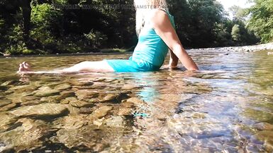Sexy t-girl swimming in mountain river and wetting teal summer dress ... - 9 image