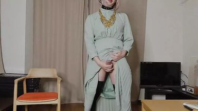Japanese crossdresser cumshots when excited by genitals touched by long dress. - 1 image