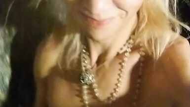 Wetlook transgirl in bathroom wearing in black dress, skirt, pantyhose and high heels - 1 image