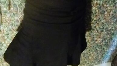 Wetlook transgirl in bathroom wearing in black dress, skirt, pantyhose and high heels - 7 image