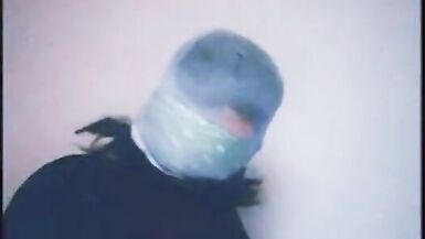 Self tightly gagged and pantyhose hooded