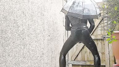 Alison outside in tight black rubber - 10 image