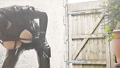 Alison outside in tight black rubber - 6 image