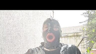 Alison outside in tight black rubber - 8 image