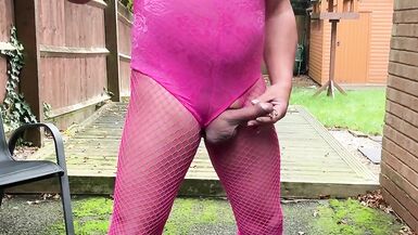 Crossdresser kellycd2022 in pink playsuit and fishnets - 14 image