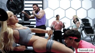 Hot gym threesome with big-titted shemales getting their butts drilled - 2 image