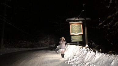 Real Non-Professional Female Masker Wearing Boots, Taut Darksome Suit in various Locations in Winter