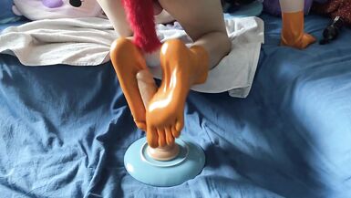 Latex Sissy gives Vibrator Footjob - 10 image