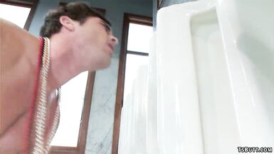 TS anal fucks man in public restroom - 14 image