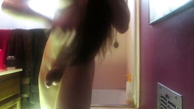 Trans Girl Oils up her Body - 1 image